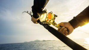 Recreational anglers on a Kenyan deep-sea fishing trip, surrounded by open ocean views.