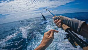 Deep-sea fishing boat with anglers off Kenya's coastline.