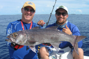 An angler holding a large sailfish caught during a deep-sea fishing trip in Kenya