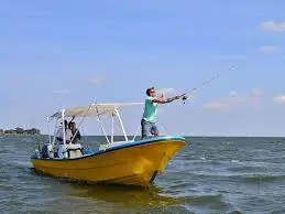 Peter's Fishing Tours boat cruising on the open waters of Lake Victoria