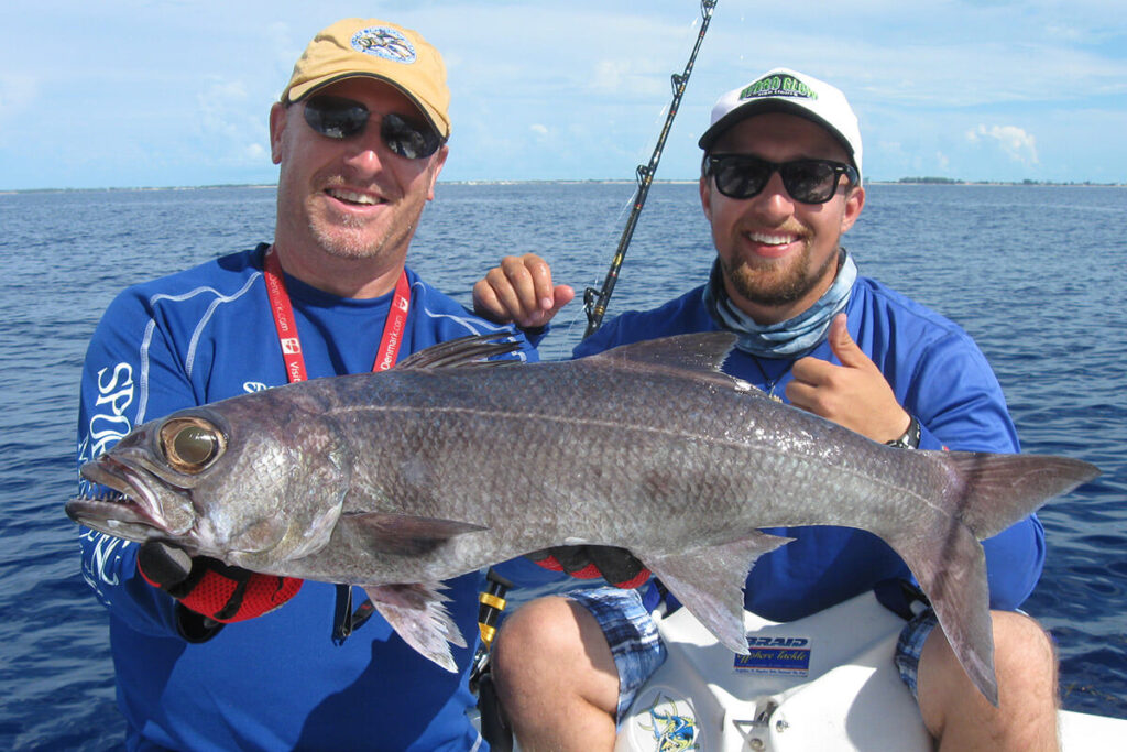 Big Game Fishing An angler holding a large sailfish caught during a Deep Sea Fishing